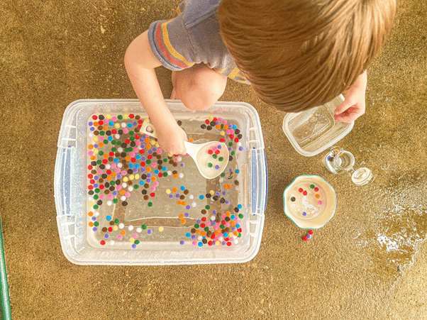 Water and Pom Pom Sensory Bin