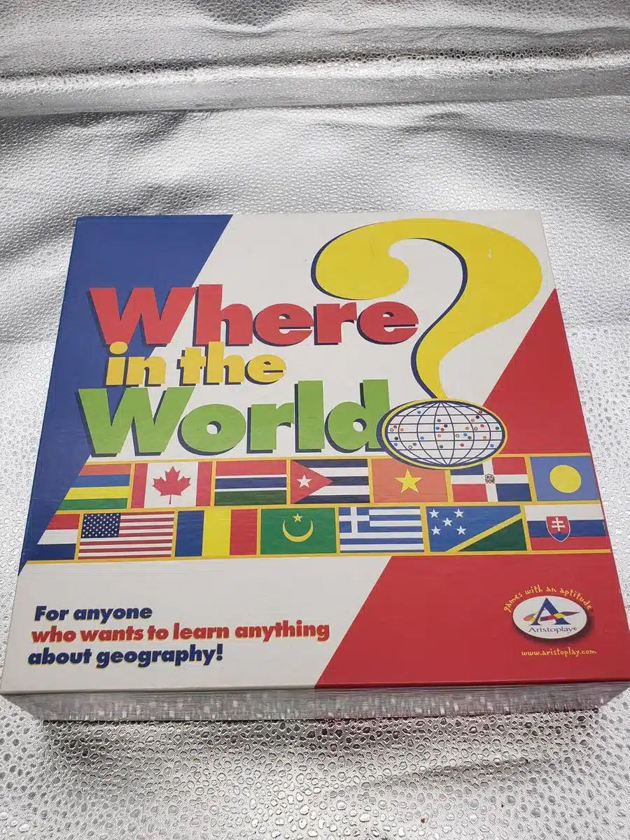A board game with a world map, players placing markers and guessing locations, challenging their knowledge of geography