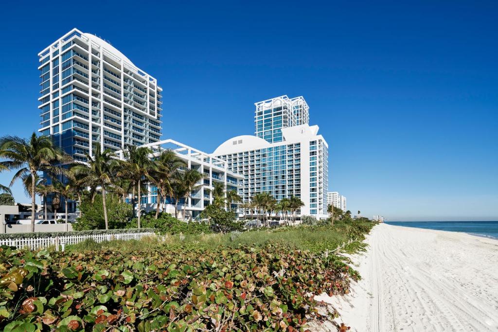 Scenic view of beach and buildings at Carillon Miami Wellness Resort in Miami, Florida