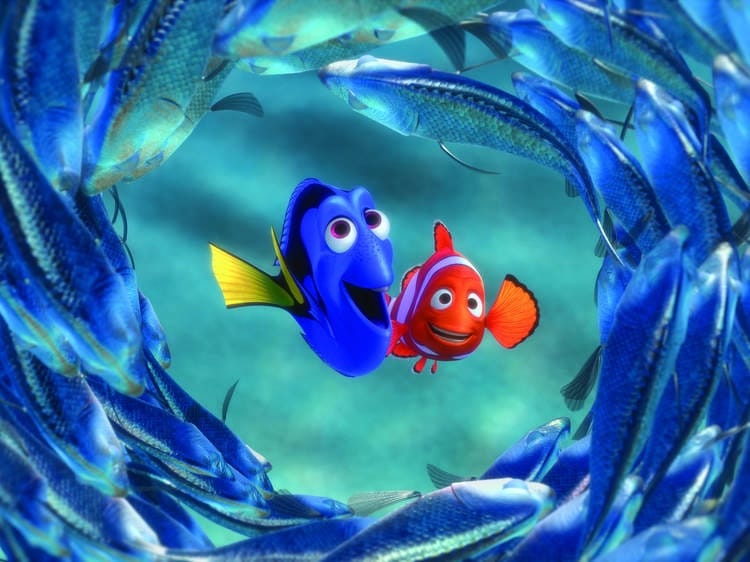 Nemo and Dory swimming together in the ocean, reminiscent of the movie 'Finding Nemo'.