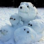 A delightful snow bear sculpture crafted from snow, adding joy to the art of creating snow creations