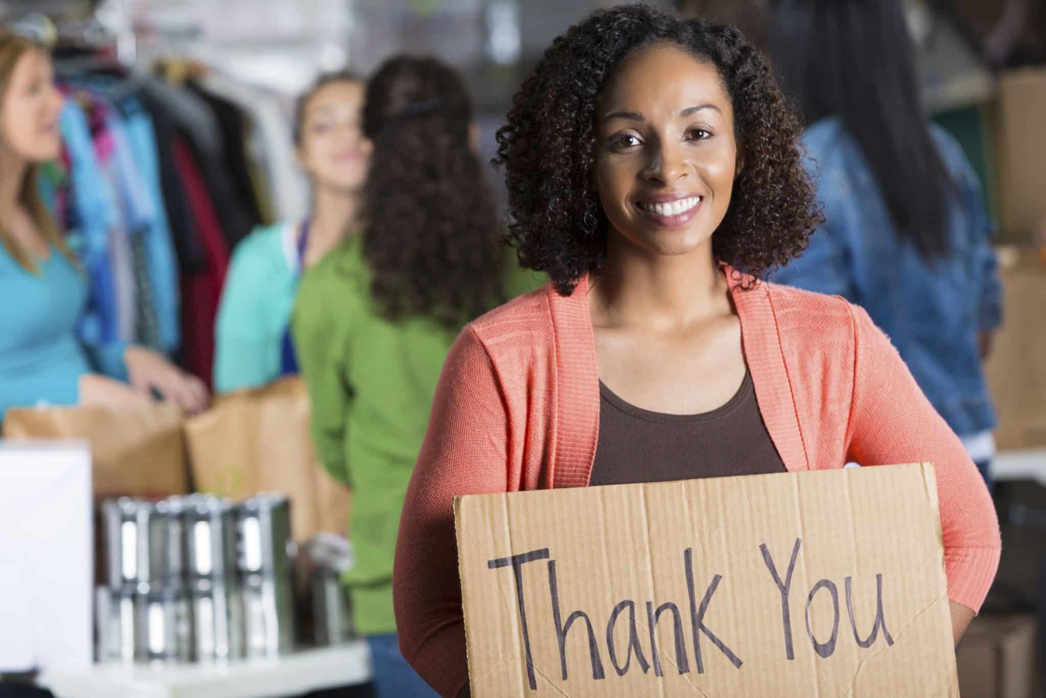 A sign saying "Thank You" in a clothing closet, expressing gratitude for the importance of a thank you message