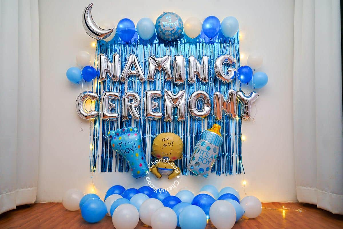 A festive balloon display in blue and white, celebrating a naming ceremony. Symbolic of new beginnings and joyous occasions