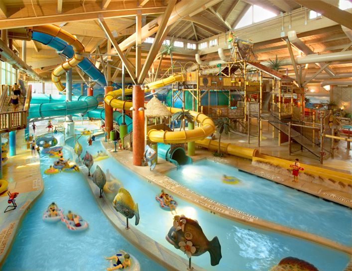 A vibrant indoor water park featuring thrilling slides and water attractions.