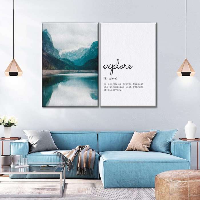 Two canvas wall art prints featuring a blue couch and coffee table, enhancing the room's vibe