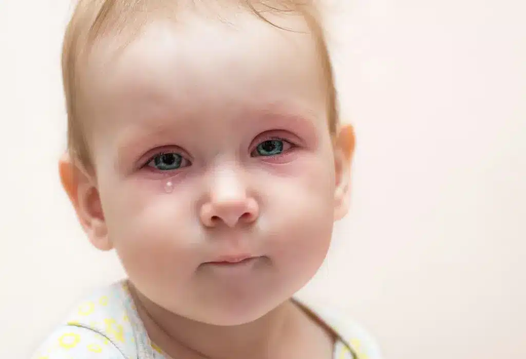 A baby with blue eyes looking at the camera. (Alt text: Baby with blue eyes, facing the camera