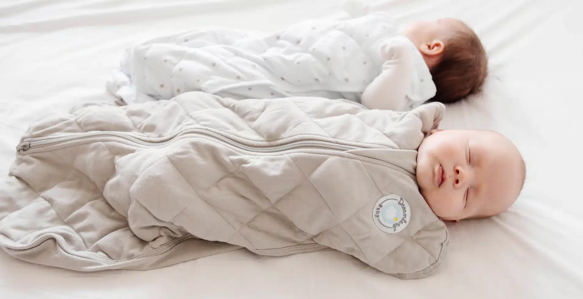 Two peacefully sleeping babies in their cozy sleeping bags, highlighting the importance of sleep for young children