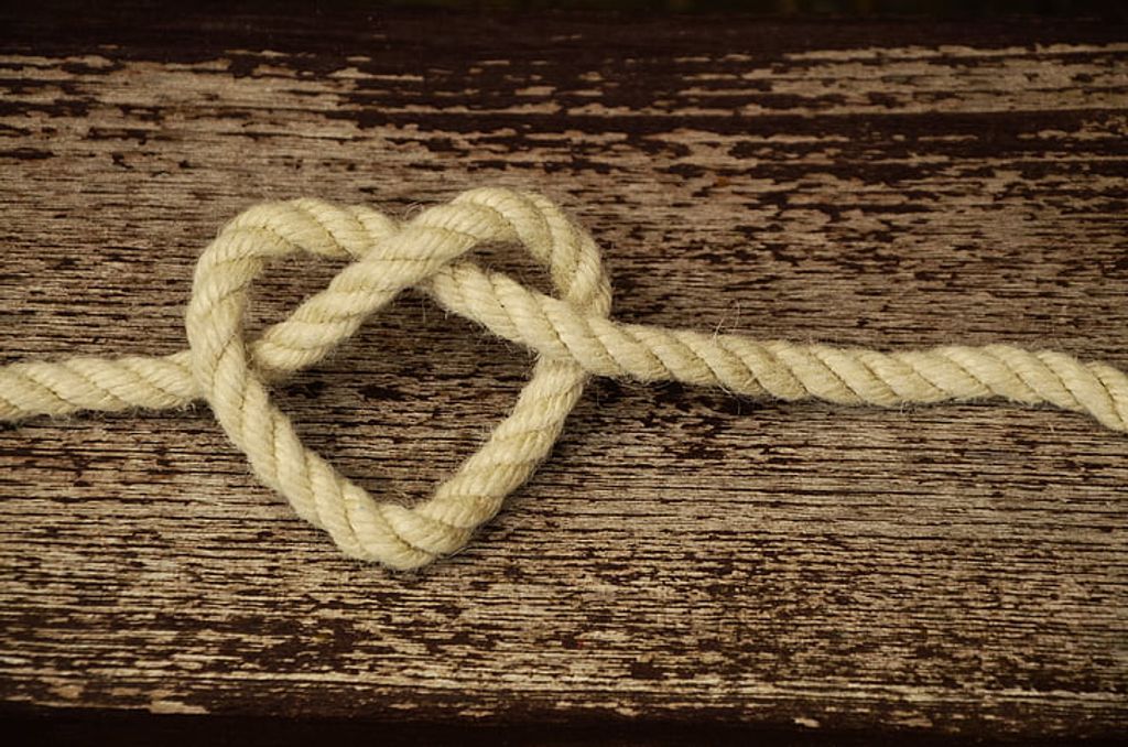 A rope with a heart-shaped knot, symbolizing love and affection. A romantic gesture with global significance