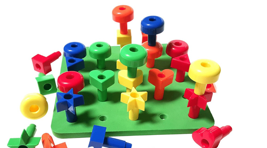Colorful plastic toy set with various shapes and pegs