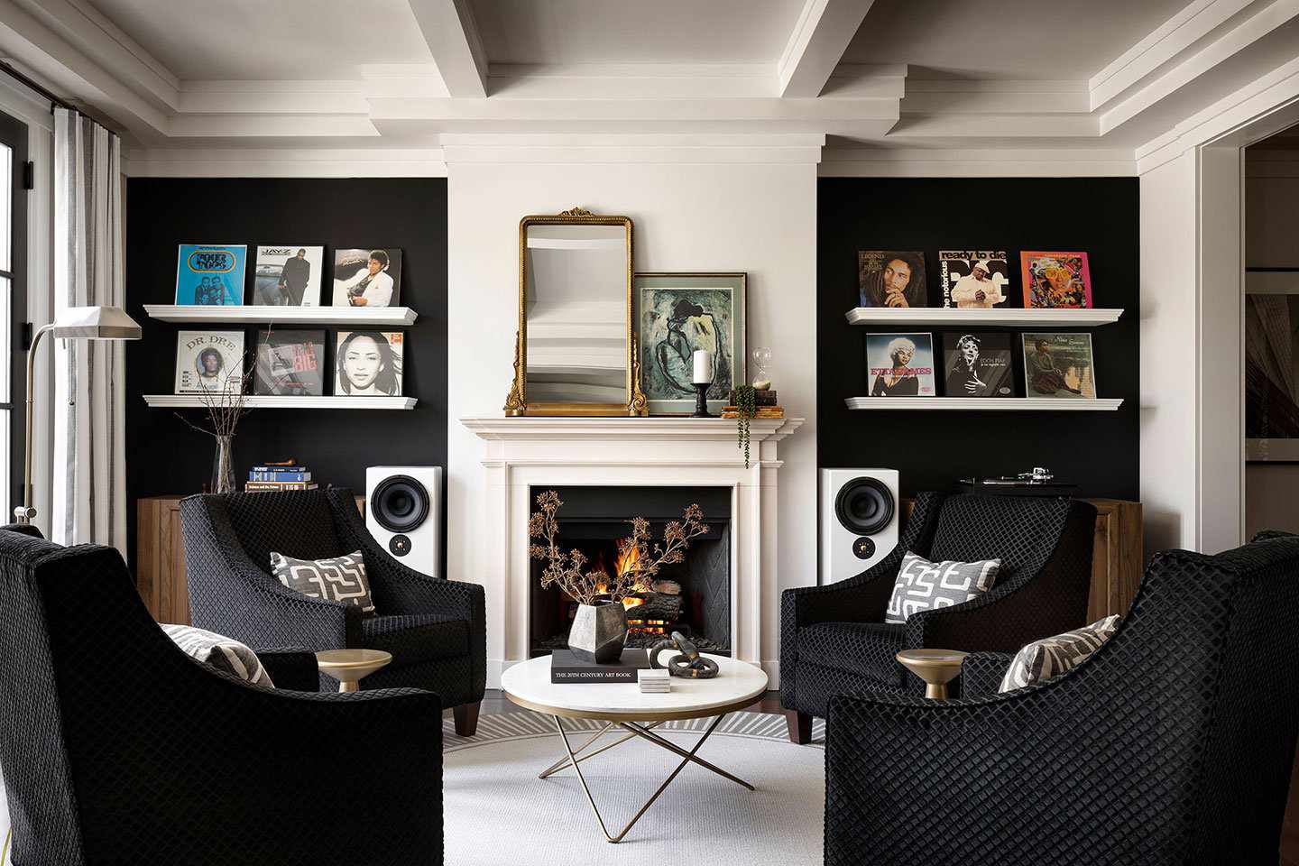 Living room with black walls, white furniture. Modern and stylish. Size of the artwork not specified