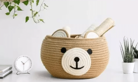 Storage basket with a cute bear face design, perfect for organizing and adding a touch of whimsy to any space