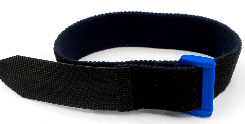 A black and blue Velcro wrist strap with a blue buckle for secure fastening