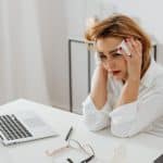 Free Woman Sitting at a Table Crying Stock Photo