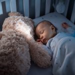 when can babies sleep with a stuffed animal